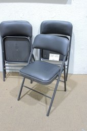 Set Of 4 Padded Folding Chairs  Gray Vinyl Seats  29.5H X 16W