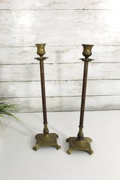 Pair Of Vintage Tall Brass Candlestick Holders  Elegant Footed Base  Antique Patina