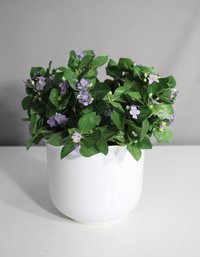 White Ceramic Flower Pot With Artificial Purple Flowers