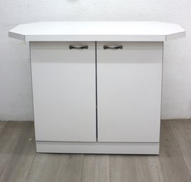 White Double Door Cabinet With Octagonal Top On Wheels