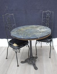 Vintage Round Bistro Table Set With Two Ornate Black Iron Chairs