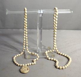 #38--Pair Of Stone Bead Necklaces With Carved Pendant