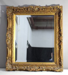 Antique-Style Ornate Gold Framed Mirror With Decorative Floral Details