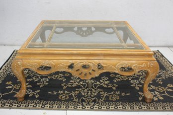 Ornate Vintage Glass-Top Coffee Table With Carved Wood Details