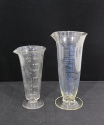 Pair Of Antique Graduated Glass Measuring Vessels  9' & 11' Tall