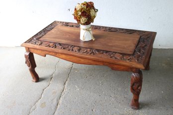 'Hand-Carved Wooden Coffee Table With Ornate Detailing  Unique Artisan Craftsmanship'