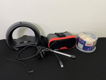 (Lot A) Tzumi VR Headset, LED Clip Light, Speaker, CD-Rs