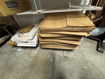 2 Stacks Of Paper Bags White And Brown