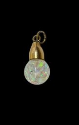 Small Pendant With Opal Chips Suspended In Liquid With A Gold Setting