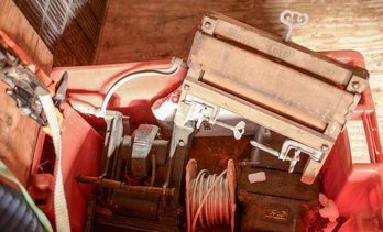 Two Electrical Transformers And A Laundry Wringer.