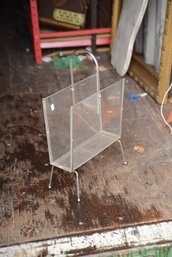 Lucite Magazine Rack.