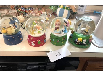 Group of Four Snow Globes
