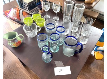 Assorted Glass and Plastic Glasses Including a Pitcher, Cruet and Creamer