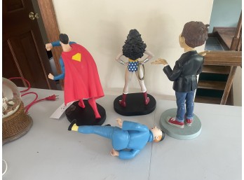 Superman and Wonder Woman with two other figures