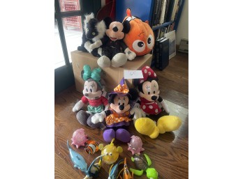 Group of Disney Stuffed Animals and Disney Plastic Bath Toys