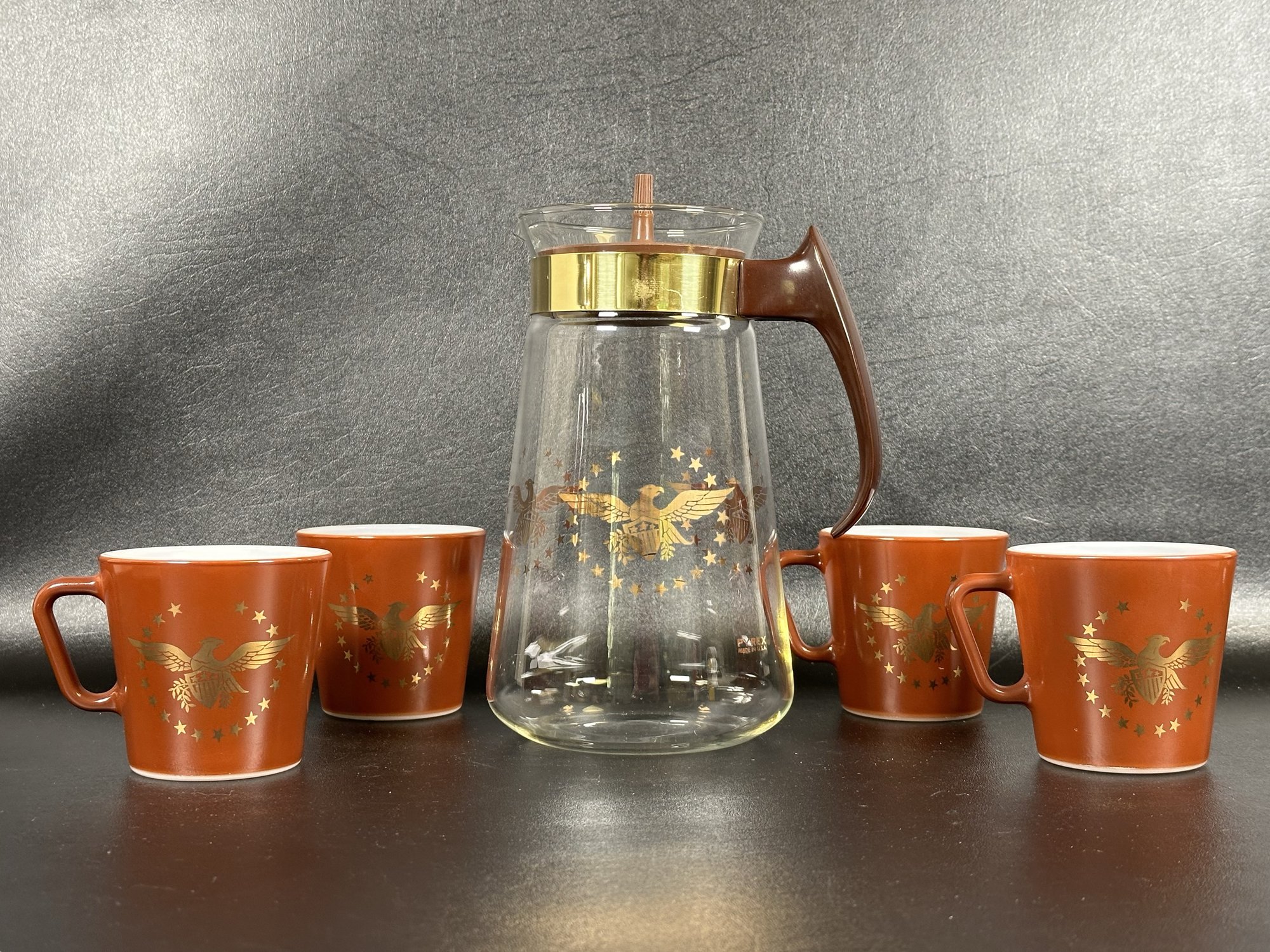 A Vintage Coffee Set By Pyrex With Carafe & Mugs Featuring A Gold Eagle ...