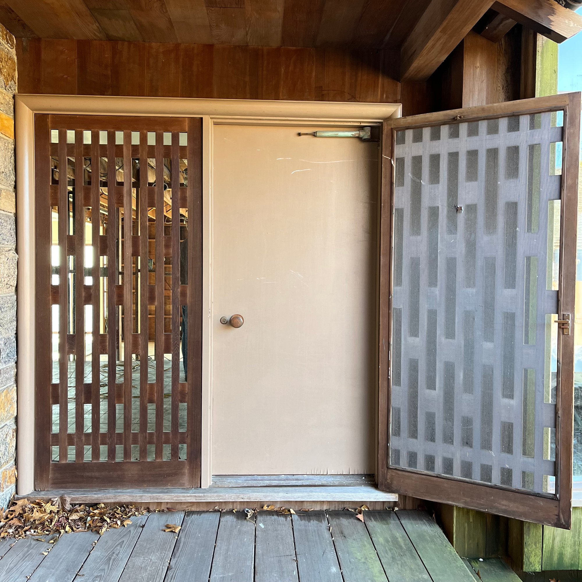 A Front Door With Side Lite Panel And Distinctive Midcentury Wood Privacy  Screens #40685717 | Auctionninja.com, image size:2000x2000