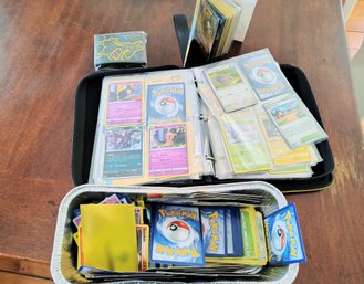 Assorted Pokemon Cards And Zippered Pokemon Card Folder