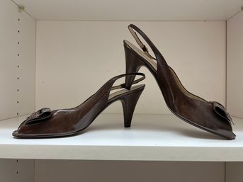 Bruno Magli Embossed Leather Animal Print Slingback Pumps In A Brown Patent Finish.