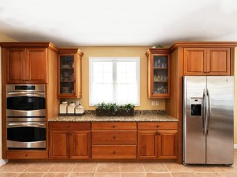 A Wall Of Custom Cherry Cabinetry By Century Cabinets And Granite Counter SEE. NOTE