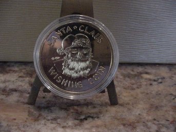 Two Uncirculated Gold Tone Santa Wishing Coins