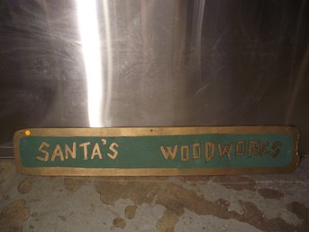 VINTAGE WOODEN HAND PAINTED SANTAS WOODWORKS SIGN.