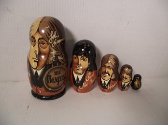 VINTAGE WOODEN HANDPAINTED BEATLES NESTING DOLLS.