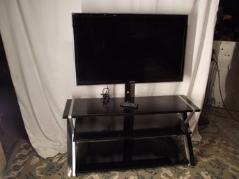 MODERN TV STAND WITH 46 INCH SAMSUNG SMART TV WITH REMOTE .