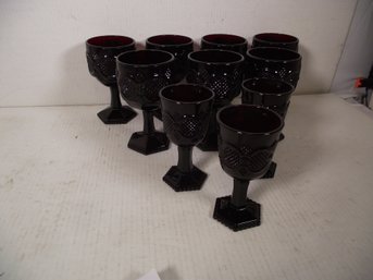 LOT OF SMALL AND LARGE RED GLASS GOBLETS BY AVON.