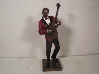 VERNESE DESIGN BLACK JAZZ MUSICIAN PLAYING THE GUITAR MADE OF RESIN.
