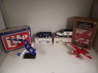 VINTAGE DIECAST TRUCKS AND PLANE COIN BANKS IN BOX.