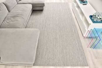 Area Rug With Banded Edge And Floor Padding