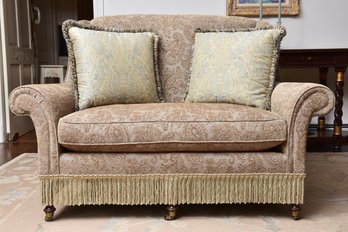 Traditional Upholstered Loveseat In Paisley Fabric With Fringe Skirt And Toss Pillows