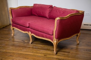 Antique Louis XV Style Settee Or Loveseat With A Carved Walnut Frame And Luxurious Berry Red Fabric