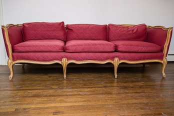 Antique Louis XV Style Three-Cushion Sofa With A Carved Walnut Frame And Luxurious Berry Red Fabric