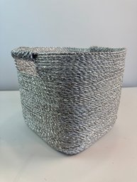 A Silver Woven Storage Basket Possibly West Elm Or CR8