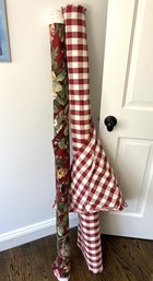 Two Bolts Of Upholstery Fabric In Tones Of Red