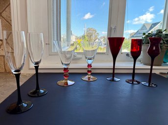 Three Ruby Red, Two Black Stem Champagne Flutes & A Vintage Pair Of Pier 1 Martini Glasses