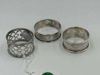 THREE HALLMARKED STERLING SILVER NAPKIN RINGS