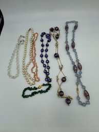 SIX VINTAGE GLASS AND STONE NECKLACES AND ONE BRACELET