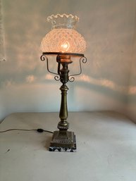 Antique Table Lamp Featuring A Patterned Glass Shade On A Brass Body With A Marble Base