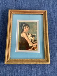 Framed Print Of A Little Girl Holding A Kitten