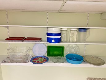 Two Shelves Full Of Glass And Plastic Platters