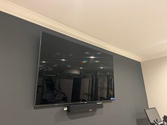 A Samsung 65 Inch LED-LCD TV - Sonos Beam - Apple TV