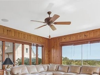 An Embellished Brown Ceiling Fan - TV Room