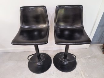 Pair Of Swiveling And Adjustable Bar Stools