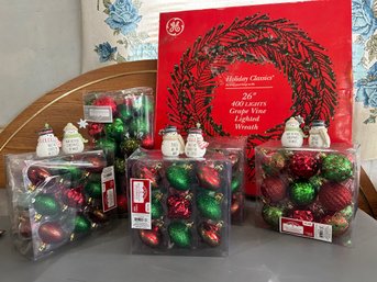 Holiday New Ornaments And Lighted Grape Vine Wreath