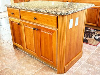 A Custom Cherry Kitchen Island With Drawers In Cabinets And Granite Top By Century Cabinets