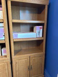 Bookcase With 3 Shelves On Top And Two Door Cabinet On Bottom