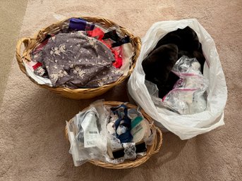 Two Baskets And One Bag Of Fabrics